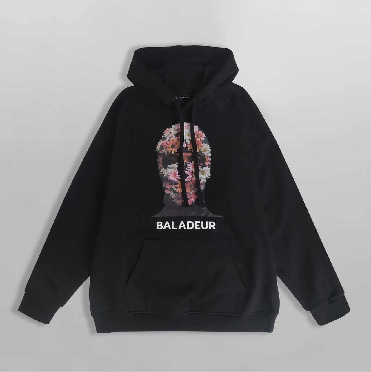 Black hoodie with floral design and 'BALADEUR' branding on a gray background