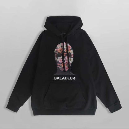 Black hoodie with floral design and 'BALADEUR' branding on a gray background